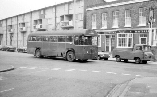 A red RF on the 236 passes Dalston Garage